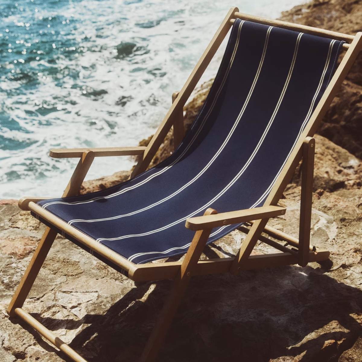 Kave Home Vilara brown and beige striped outdoor folding deck chair made of FSC 100% solid acacia wood