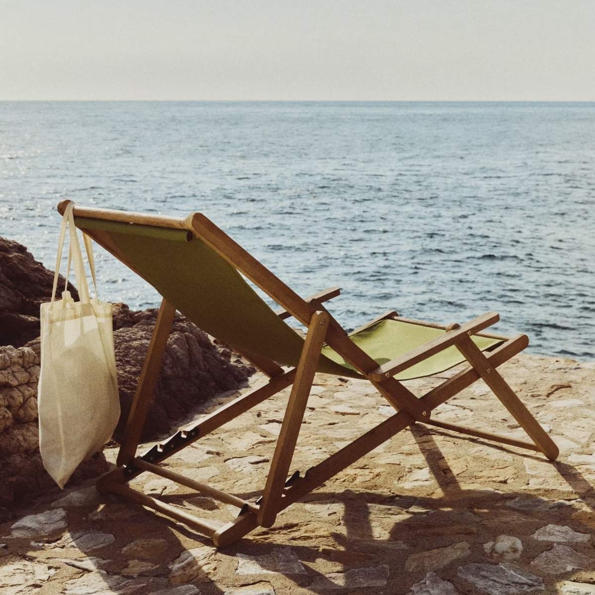 Kave Home Vilara brown and beige striped outdoor folding deck chair made of FSC 100% solid acacia wood