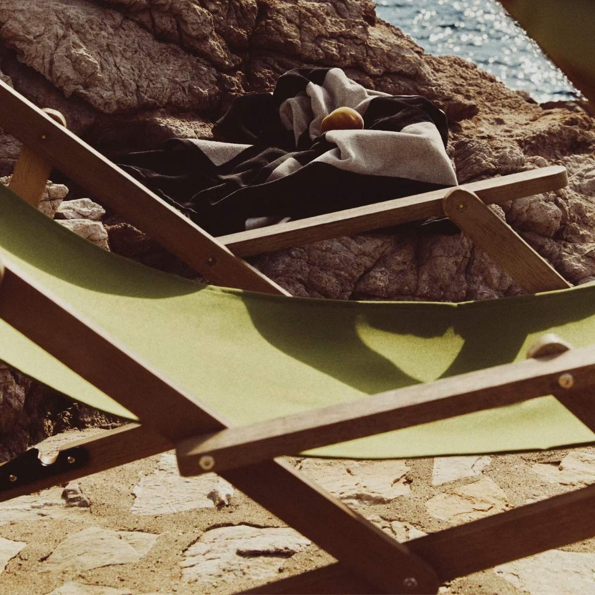 Kave Home Vilara brown and beige striped outdoor folding deck chair made of FSC 100% solid acacia wood