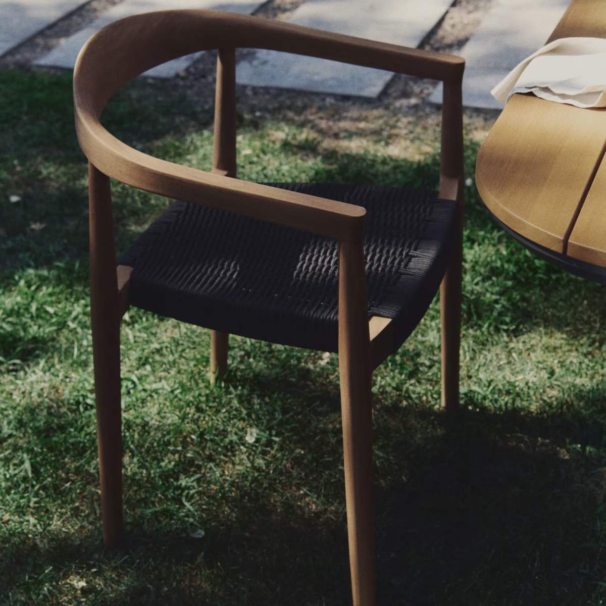 Kave Home Ydalia stackable outdoor chair in solid teak wood with natural finish and black rope