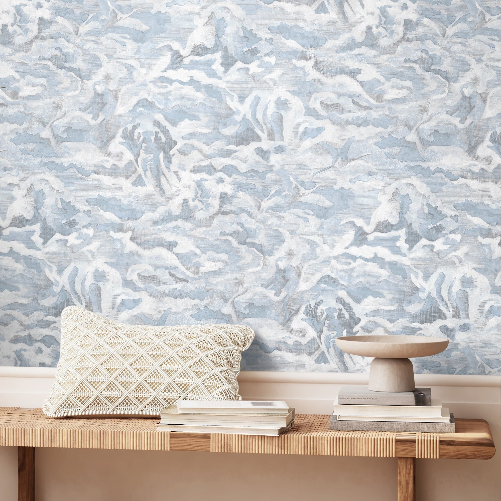 Brand McKenzie Hidden Clouds Wallpaper - Pastel Blue BMWL005/05B rattan bench and natural cotton cushion